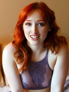 The beautiful redhead Lady Noire shows her naked body